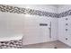 Large walk-in shower with multiple shower heads and mosaic tile at 1820 S State Highway 83, Franktown, CO 80116