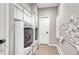 Convenient laundry room with washer, dryer, and folding counter at 1820 S State Highway 83, Franktown, CO 80116