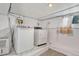 Basement laundry area with washer, dryer and storage space at 1820 S State Highway 83, Franktown, CO 80116