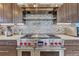 Modern kitchen features with stainless steel range and a stylish backsplash at 1820 S State Highway 83, Franktown, CO 80116
