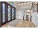 Elegant entryway with modern double doors and hardwood floors at 1820 S State Highway 83, Franktown, CO 80116