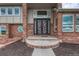 Elegant house entrance with a unique metal door at 1820 S State Highway 83, Franktown, CO 80116