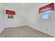 Well-lit bedroom with neutral carpeting and large windows at 1820 S State Highway 83, Franktown, CO 80116