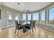Bright dining room with large windows and seating for six at 1820 S State Highway 83, Franktown, CO 80116