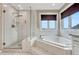 Large bathroom with a walk-in shower and a corner bathtub at 1820 S State Highway 83, Franktown, CO 80116