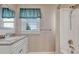 Clean bathroom with updated vanity and shower/tub combo at 1820 S State Highway 83, Franktown, CO 80116