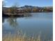 Peaceful lake view with mountain backdrop at 1948 S Balsam St, Lakewood, CO 80227