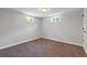 Finished basement area with neutral walls and carpet at 7946 Joan Dr, Denver, CO 80221