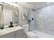 Basement bathroom with a walk-in shower and modern fixtures at 7946 Joan Dr, Denver, CO 80221