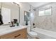 Contemporary bathroom with marble tile, a soaking tub, and modern vanity at 7946 Joan Dr, Denver, CO 80221