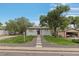 Charming ranch home with landscaped yard and detached garage at 7946 Joan Dr, Denver, CO 80221