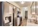 Modern kitchen with stainless steel appliances and gray cabinets at 7695 E Quincy Ave # 102, Denver, CO 80237