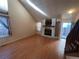 Spacious living room featuring hardwood floors and fireplace at 8356 W 87Th Dr # A, Arvada, CO 80005