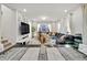 Dining area with a view of the open plan living room, decorated with a stylish centerpiece at 4780 N Kalispell St, Denver, CO 80239