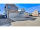 Front exterior of a two-story home with attached garage and driveway at 4780 N Kalispell St, Denver, CO 80239