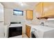 Basement laundry area with washer and dryer at 3765 S Hazel Ct, Englewood, CO 80110