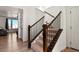 Elegant staircase with wooden handrails and black metal balusters at 983 High Point Trl, Elizabeth, CO 80107