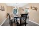 Charming dining room featuring a table with four chairs and a chandelier at 7360 E Hinsdale Ave, Centennial, CO 80112