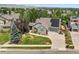 Aerial view of house with solar panels, landscaping and driveway at 17085 W 62Nd Cir, Arvada, CO 80403