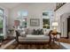 Elegant living room with a chaise lounge and hardwood floors at 20127 Aintree Ct, Parker, CO 80138