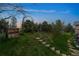 Landscaped side yard with stone pathway and garden features at 20127 Aintree Ct, Parker, CO 80138