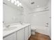 Bathroom with double vanity, bathtub, and wood-look floors at 4599 Boone Cir, Brighton, CO 80601