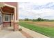 Patio with view of open space and distant homes at 13722 Legend Way # 101, Broomfield, CO 80023