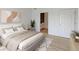 Spacious bedroom with a comfortable bed and en-suite bathroom access at 13722 Legend Way # 101, Broomfield, CO 80023