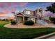 Two-story home with red siding, landscaping, and walkway at 13722 Legend Way # 101, Broomfield, CO 80023