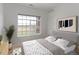 Bright bedroom with a comfortable bed and large window at 13722 Legend Way # 101, Broomfield, CO 80023