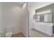 Clean bathroom with double vanity and tile flooring at 13722 Legend Way # 101, Broomfield, CO 80023