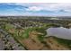 Community overview, including golf course and lake at 13722 Legend Way # 101, Broomfield, CO 80023