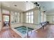 Indoor hot tub with seating area and large windows at 13722 Legend Way # 101, Broomfield, CO 80023