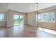 Bright dining room with hardwood floors and sliding glass door to deck at 8500 W 62Nd Ave # H, Arvada, CO 80004