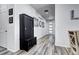 Hallway with dark wood-look flooring and a built-in bench at 802 Eva Peak Dr, Erie, CO 80516