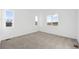 Spacious bedroom with multiple windows and carpeted floor at 1268 Penner Dr, Erie, CO 80026