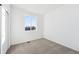 Simple bedroom with a window and carpeted floor at 1268 Penner Dr, Erie, CO 80026