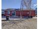 Home's backyard with patio, shed, and firepit at 5305 Willow Ct, Castle Rock, CO 80104