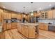 Spacious kitchen with granite island, stainless steel appliances, and light wood cabinets at 6398 Lost Canyon Ranch Rd, Castle Rock, CO 80104