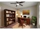 Home office with built-in shelving and wood desk at 7877 York St # 1, Denver, CO 80229