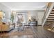 Living room with light gray sofa and wood floors at 4455 W Ponds Cir, Littleton, CO 80123