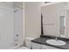 Clean bathroom with updated vanity and bathtub shower combo at 14321 E Tennessee Ave # 1-105, Aurora, CO 80012