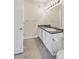 Simple bathroom with vanity, toilet and dark countertop at 14321 E Tennessee Ave # 1-105, Aurora, CO 80012