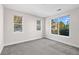Well-lit bedroom with neutral walls and large windows at 14321 E Tennessee Ave # 1-105, Aurora, CO 80012