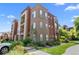 Modern condo building with attractive landscaping and ample parking at 14321 E Tennessee Ave # 1-105, Aurora, CO 80012