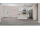 Open concept kitchen with island and ample cabinet space at 14321 E Tennessee Ave # 1-105, Aurora, CO 80012