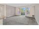 Spacious living room with sliding glass doors leading to a balcony at 14321 E Tennessee Ave # 1-105, Aurora, CO 80012
