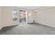 Spacious living room with access to a private balcony at 14321 E Tennessee Ave # 1-105, Aurora, CO 80012