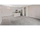 Open and airy living area with carpeted flooring at 14321 E Tennessee Ave # 1-105, Aurora, CO 80012