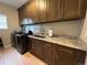 Laundry room with washer, dryer and cabinets at 7047 Lionshead Pkwy, Lone Tree, CO 80124